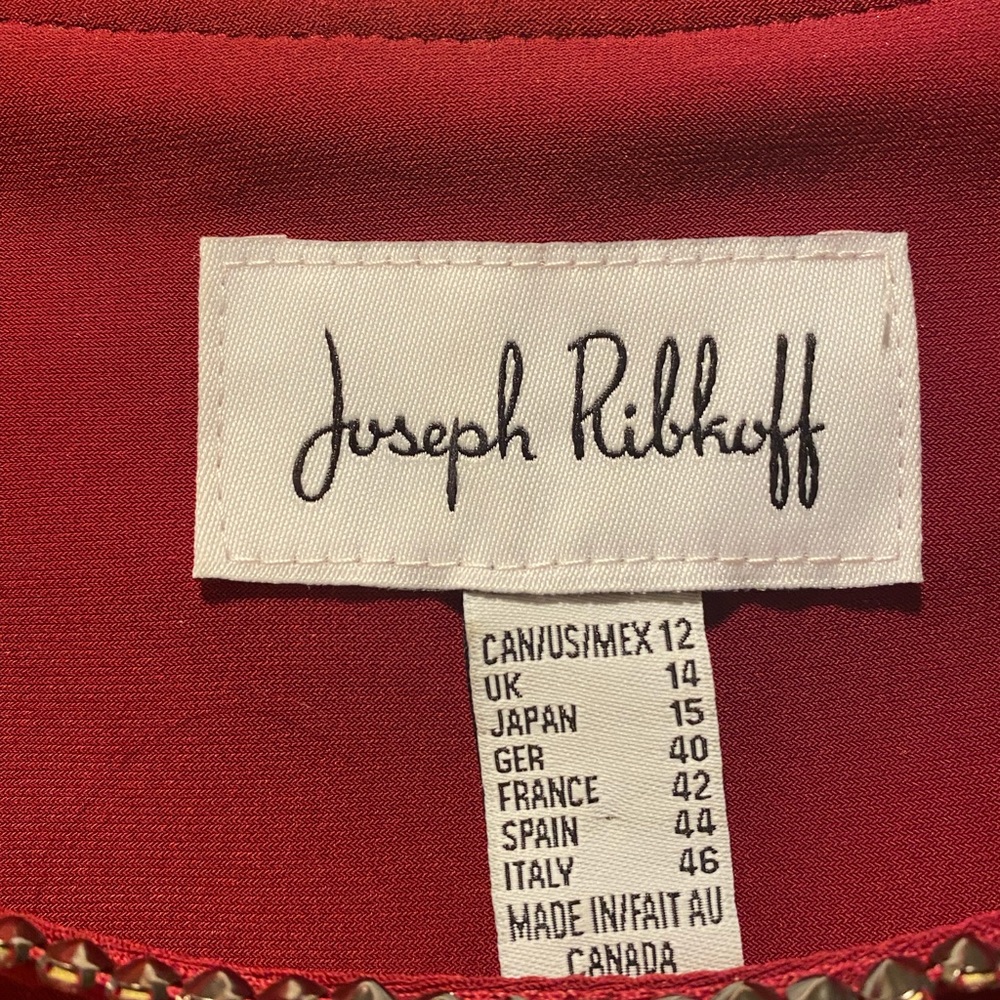 Joseph Ribkoff never worn rusty red top in size 12. Rhinestone trim